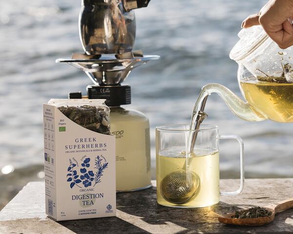 Hot Greek herbal tea being poured