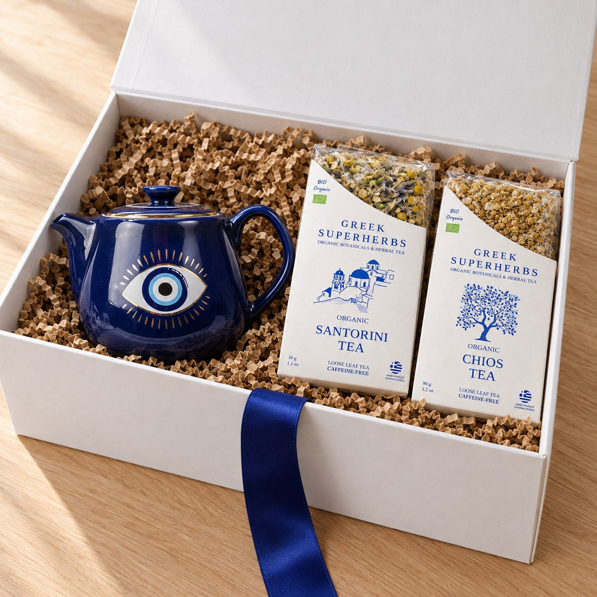 Evil Eye Tea Ritual Gift Set — Blue Teapot — open white gift box with kraft crinkle paper and blue ribbon