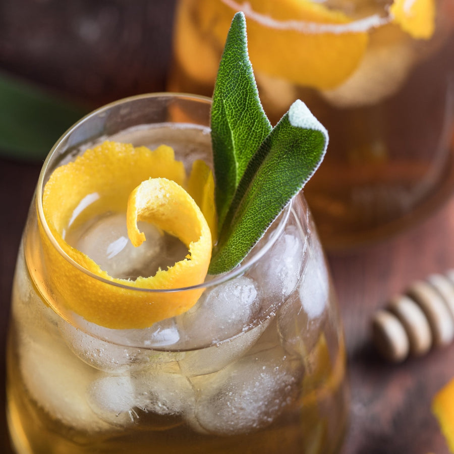 A glass of iced sage tea with lemon