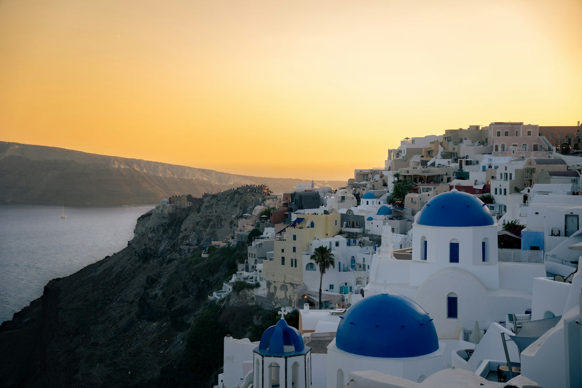 Blue domes of Oia, Santorini, at sunset