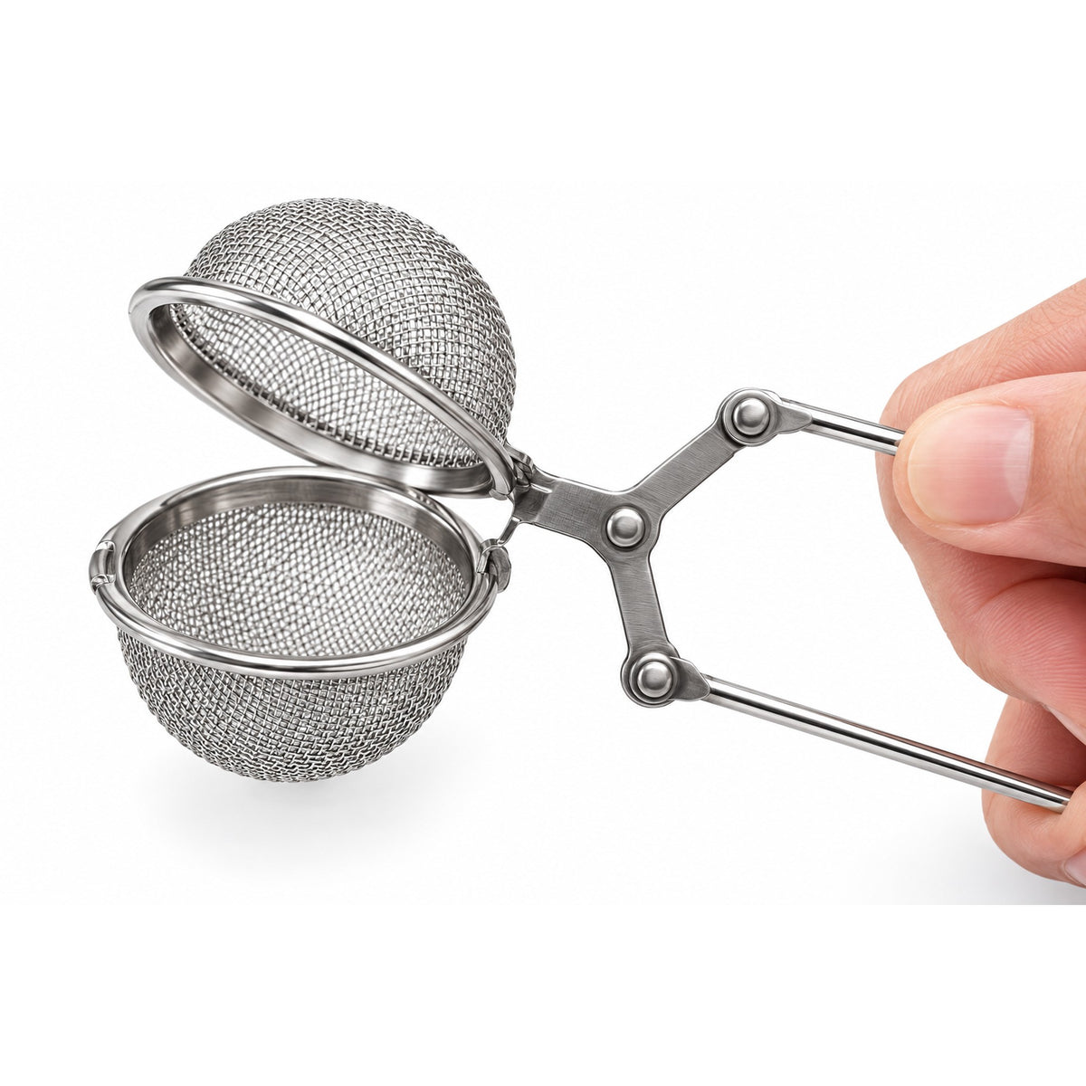 Squeeze the handle and the fine stainless mesh ball opens for filling