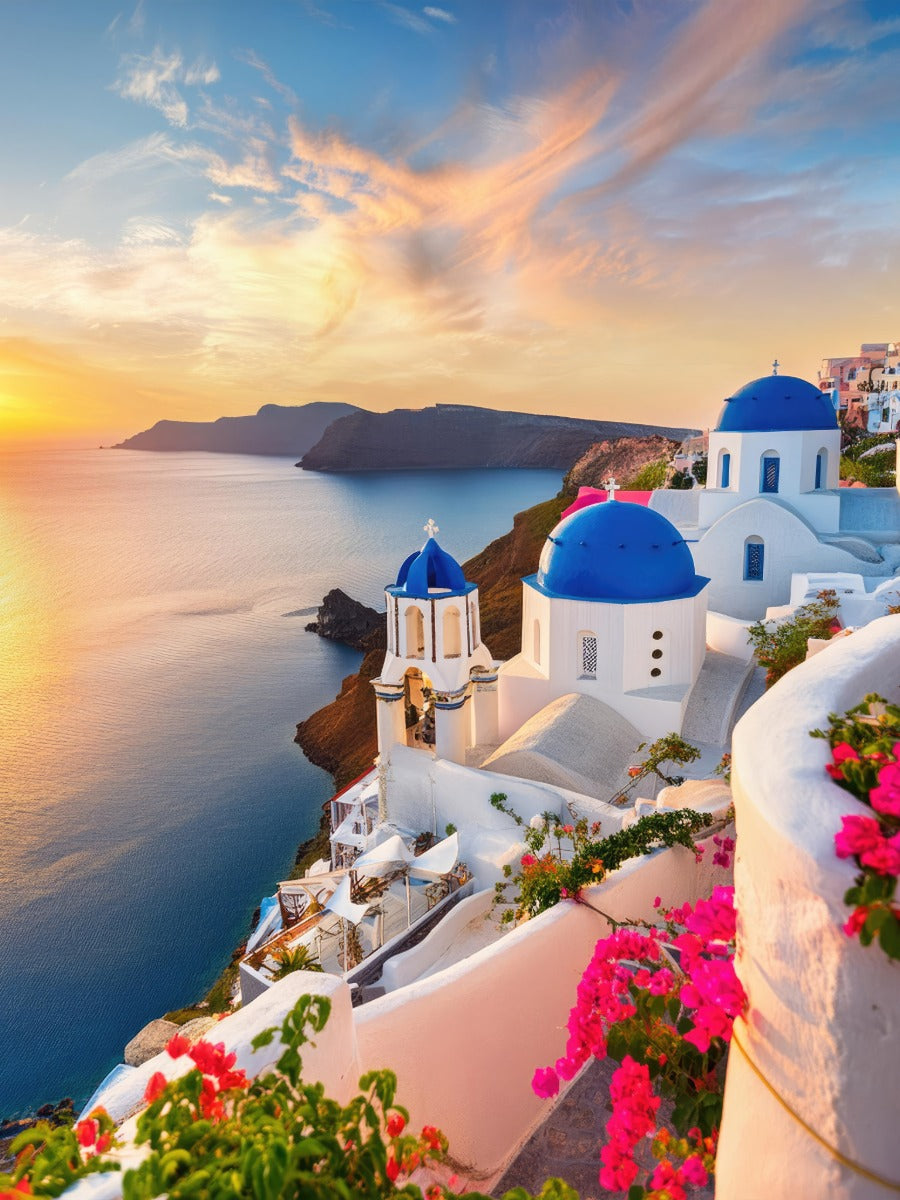 Oia, Santorini at sunset — blue domes above the caldera