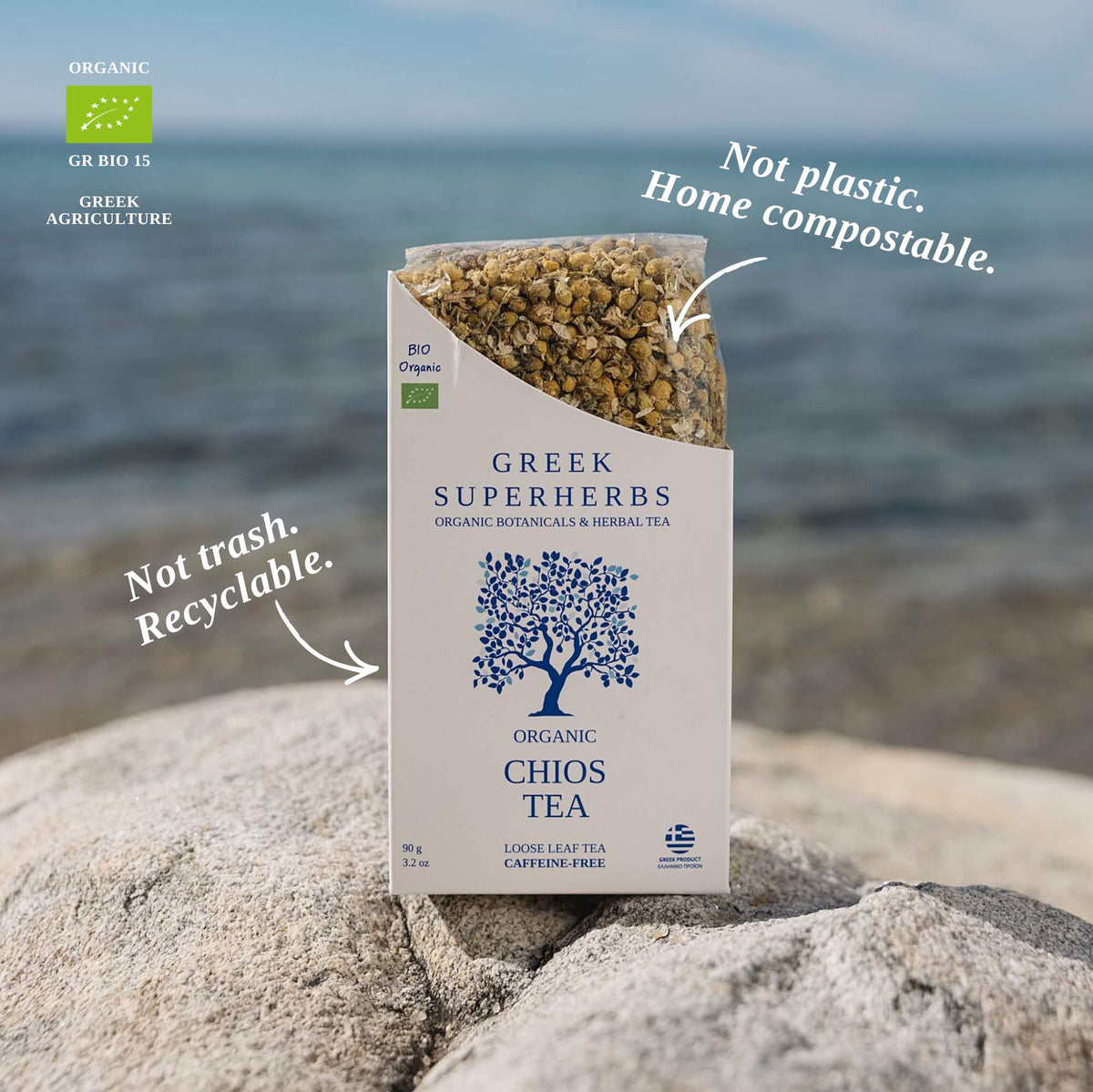 Greek Superherbs compostable tea packaging on a wooden table